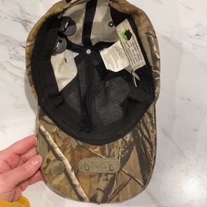 Camouflage ball cap with headlights in the bill